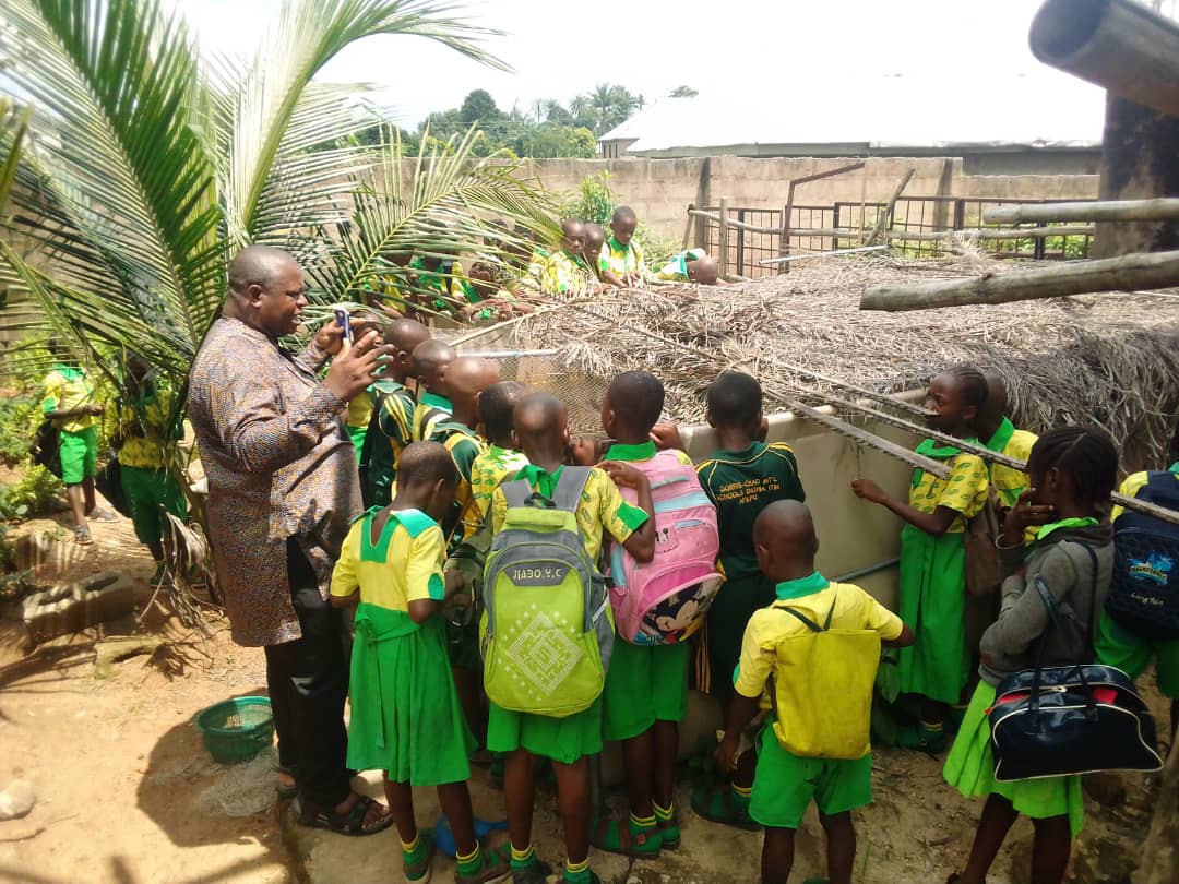 Training the students with skills on fish farming at GINMI